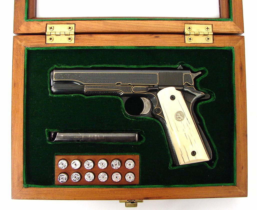 Colt 1911A1 ivory grips and has gold frame